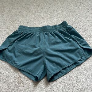 Green athletics shorts